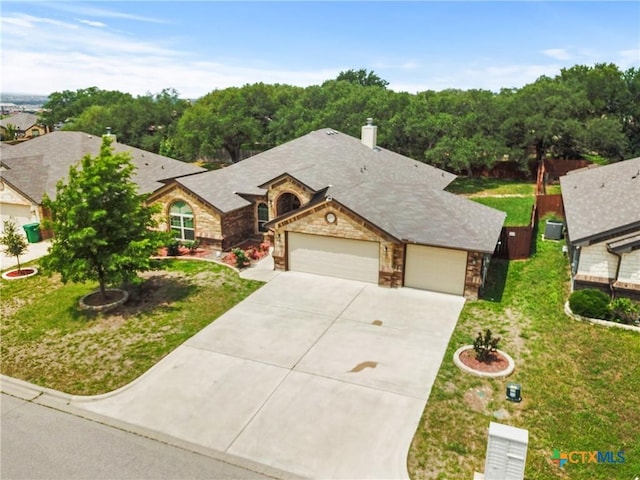 2034 Falling Leaf Ln, Harker Heights, TX 76548 - view of front facade featuring a chimney, a front lawn, concrete driveway, an attached garage, and stone siding