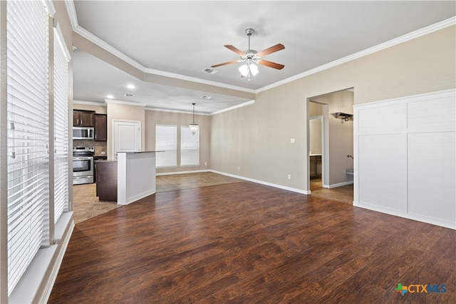 unfurnished living room featuring dark wood-type flooring, ceiling fan, and crown molding