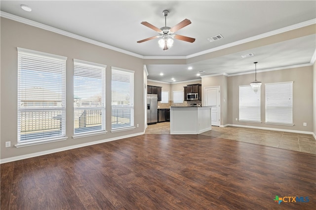 unfurnished living room featuring ceiling fan, dark hardwood / wood-style flooring, and ornamental molding