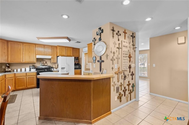 kitchen with stainless steel range with electric stovetop, light tile patterned floors, and white refrigerator with ice dispenser