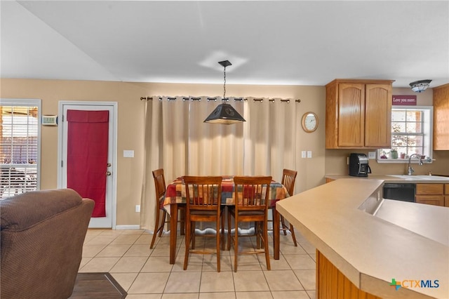 tiled dining area featuring sink and a wealth of natural light