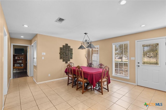 dining space with light tile patterned floors