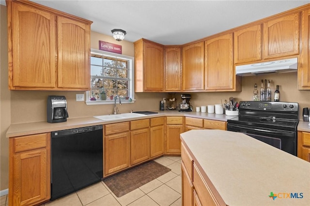 kitchen with light tile patterned floors, black appliances, and sink