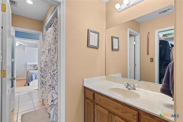 bathroom with tile patterned flooring and vanity