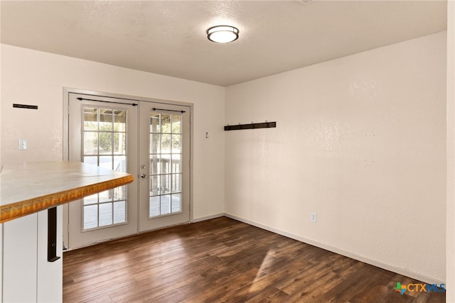 interior space featuring dark hardwood / wood-style flooring and french doors