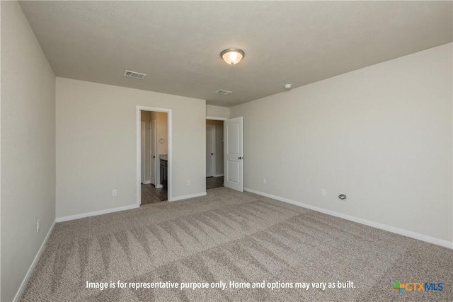 1214 Dowdy Dr, Belton, TX 76513 - unfurnished bedroom with baseboards, visible vents, carpet flooring, and ensuite bathroom