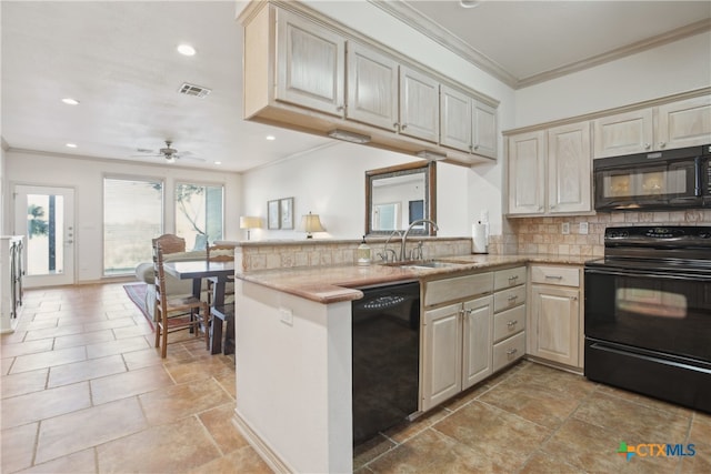 kitchen featuring ceiling fan, sink, kitchen peninsula, decorative backsplash, and black appliances