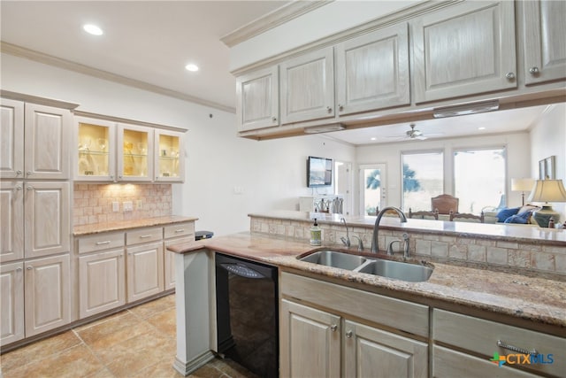 kitchen with black dishwasher, light stone counters, ornamental molding, and sink