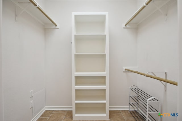 spacious closet featuring tile patterned floors