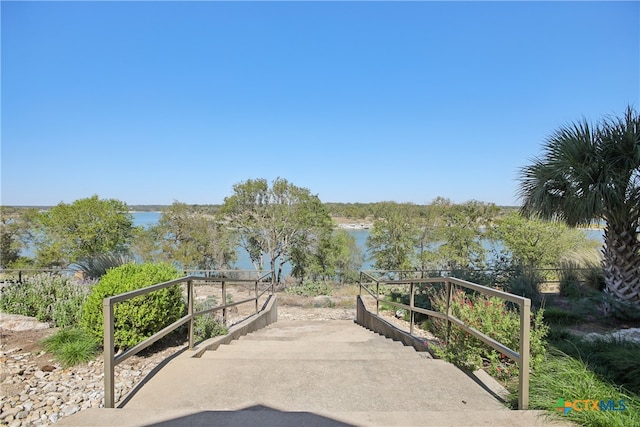 view of community with a water view