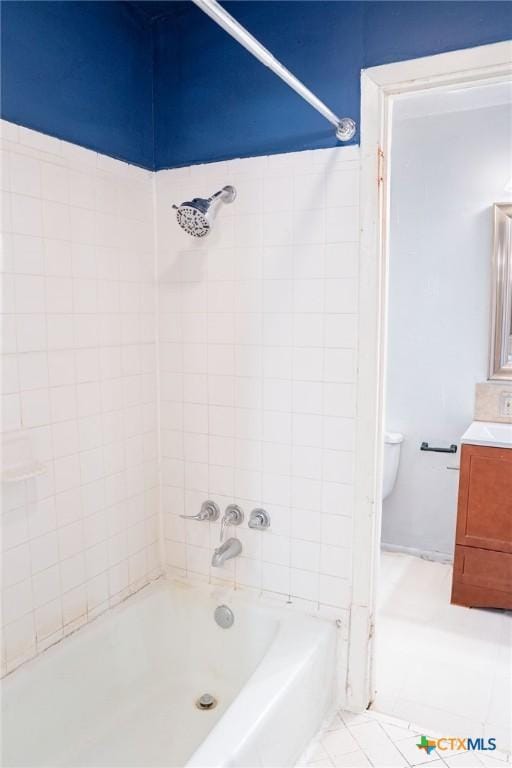 full bath with tile patterned flooring, shower / bath combination, vanity, and toilet