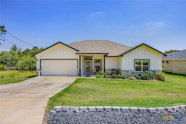 view of front facade with a garage and a front lawn