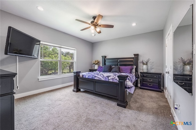 carpeted bedroom with ceiling fan