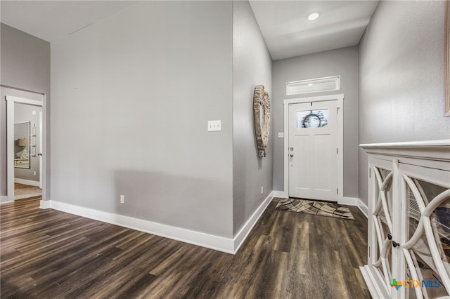 entrance foyer featuring dark hardwood / wood-style floors