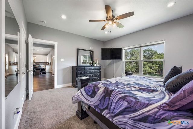 carpeted bedroom featuring ceiling fan