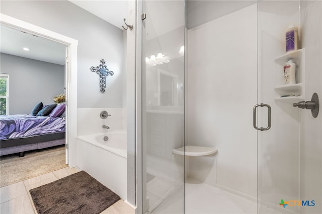 bathroom featuring tile patterned flooring and plus walk in shower