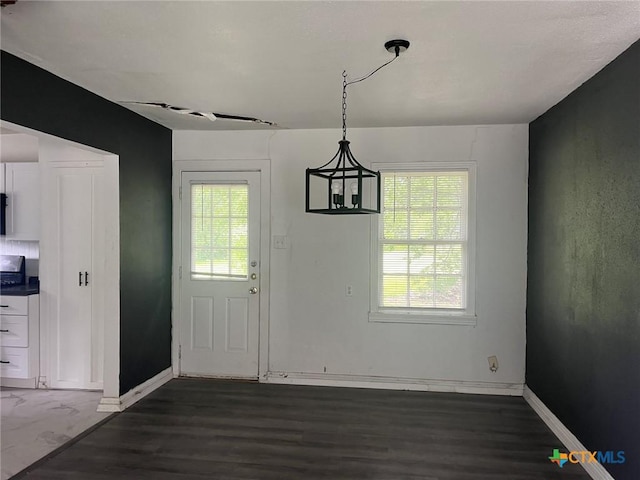 1601 S 35th St, Temple, TX 76504 - unfurnished dining area with dark wood-style flooring