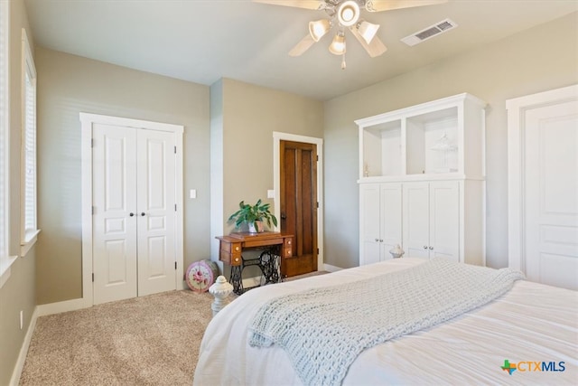 carpeted bedroom featuring ceiling fan