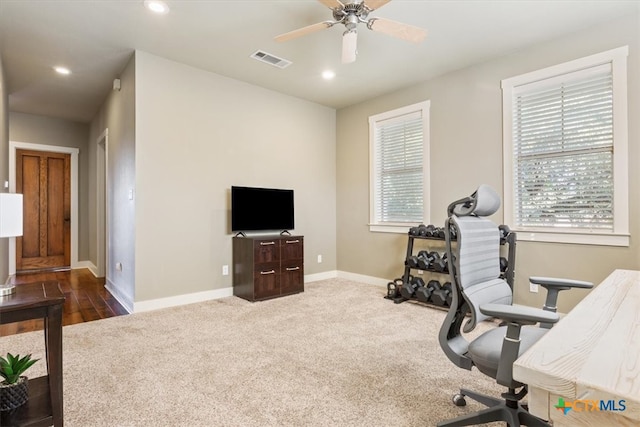 home office featuring carpet flooring and ceiling fan