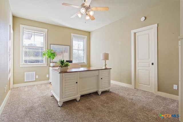 unfurnished office with light colored carpet and ceiling fan