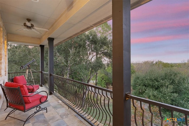 balcony at dusk with ceiling fan