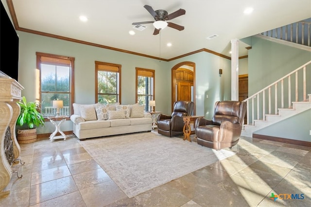 living room featuring ceiling fan and crown molding