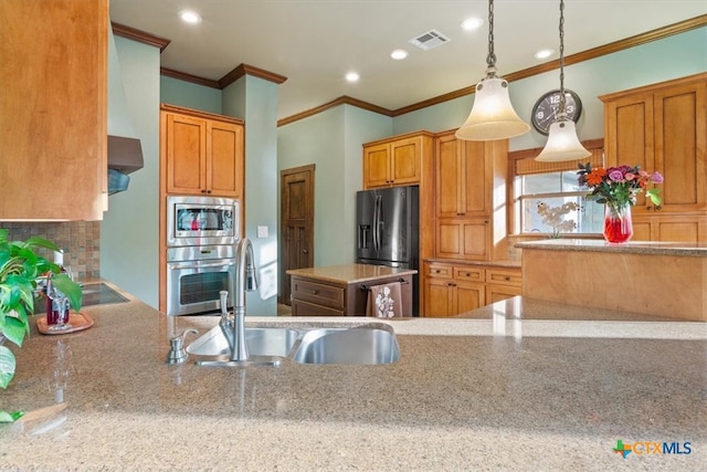 kitchen featuring sink, stainless steel appliances, crown molding, decorative light fixtures, and decorative backsplash