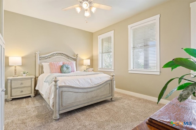 bedroom with light carpet and ceiling fan