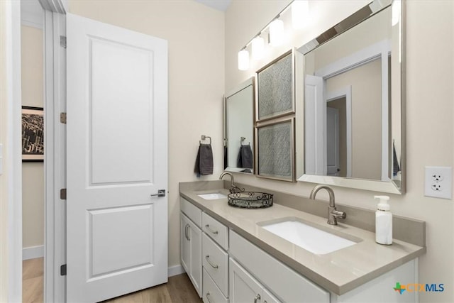 bathroom featuring vanity and hardwood / wood-style floors