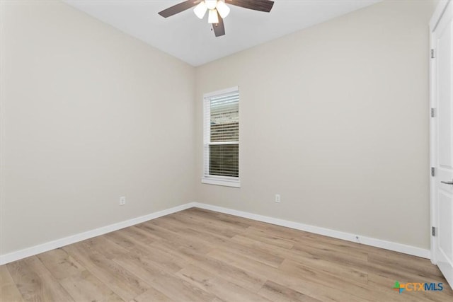 unfurnished room featuring baseboards, a ceiling fan, and light wood finished floors