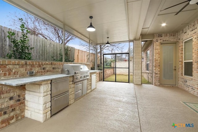 view of patio featuring area for grilling and a fenced backyard