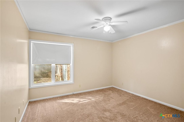 unfurnished room with ceiling fan, carpet floors, and ornamental molding