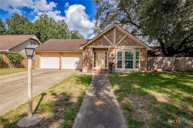 view of front of home featuring a front yard and a garage