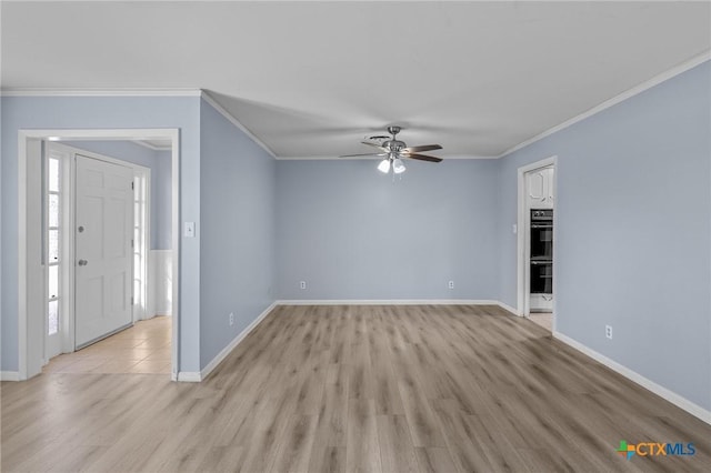 unfurnished room featuring ceiling fan, crown molding, and light hardwood / wood-style flooring