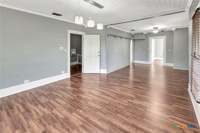 214 Hubbard St, Yoakum, TX 77995 - spare room with ceiling fan, crown molding, baseboards, and wood finished floors