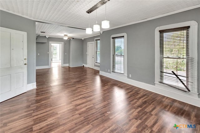 214 Hubbard St, Yoakum, TX 77995 - unfurnished room with baseboards, crown molding, and wood finished floors