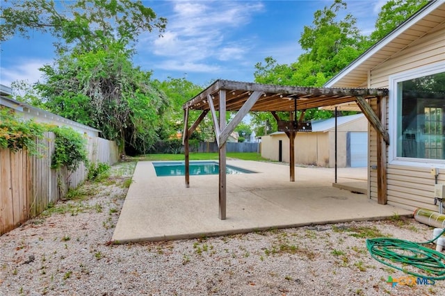 214 Hubbard St, Yoakum, TX 77995 - view of swimming pool with a fenced backyard, a patio area, and an outbuilding