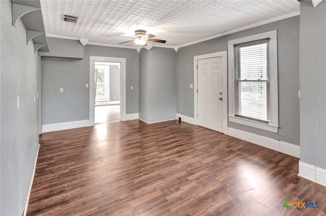 214 Hubbard St, Yoakum, TX 77995 - spare room with crown molding, ceiling fan, wood finished floors, baseboards, and a textured wall