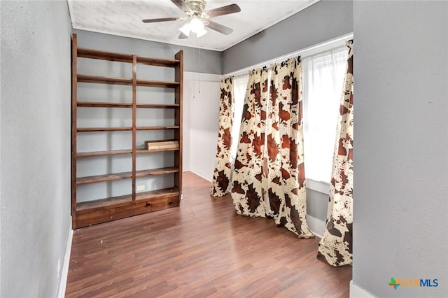 214 Hubbard St, Yoakum, TX 77995 - unfurnished room featuring wood finished floors and a ceiling fan