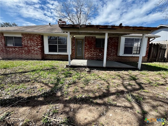 6430 Ridge Village Dr, San Antonio, TX 78233 - view of front of home with brick siding, fence, and a chimney