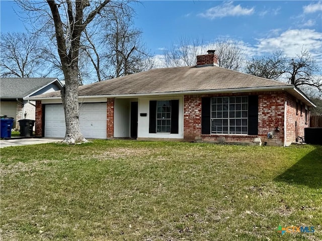 ranch-style home featuring an attached garage, brick siding, a chimney, and a front yard