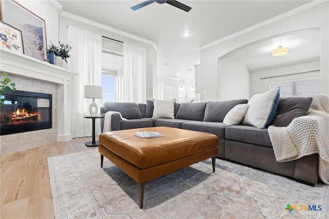 1827 Broken Shoe Trl, Temple, TX 76502 - living room featuring hardwood / wood-style flooring, ornamental molding, a ceiling fan, a tiled fireplace, and recessed lighting