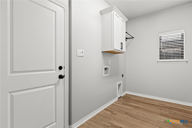 1827 Broken Shoe Trl, Temple, TX 76502 - washroom with electric dryer hookup, hookup for a washing machine, light wood finished floors, and cabinet space