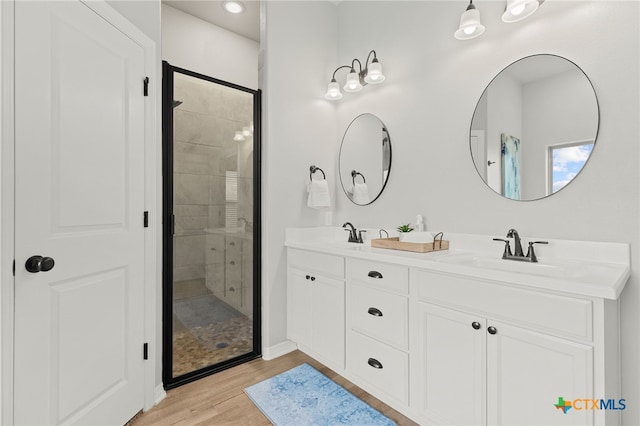 1827 Broken Shoe Trl, Temple, TX 76502 - full bath featuring a stall shower, double vanity, wood finished floors, and recessed lighting