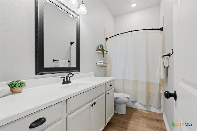 1827 Broken Shoe Trl, Temple, TX 76502 - bathroom with vanity, wood finished floors, shower / tub combo with curtain, and recessed lighting