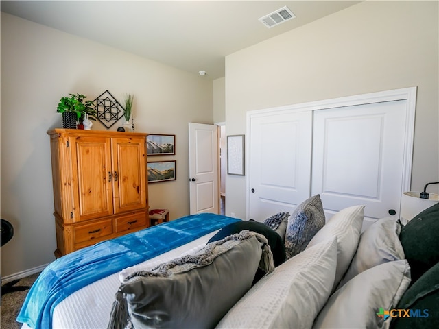 carpeted bedroom featuring a closet