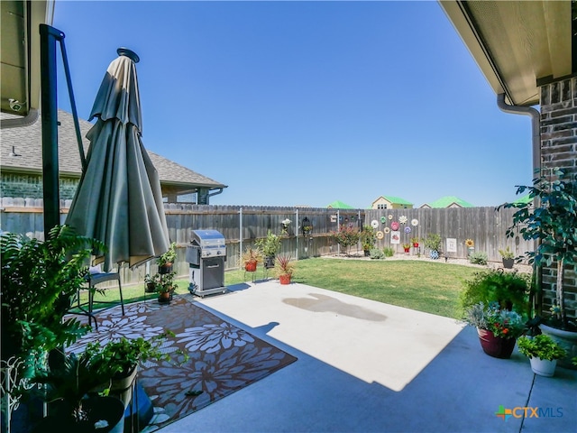 view of patio with a grill