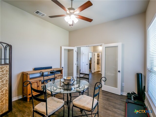 dining area with dark wood-type flooring, french doors, and ceiling fan