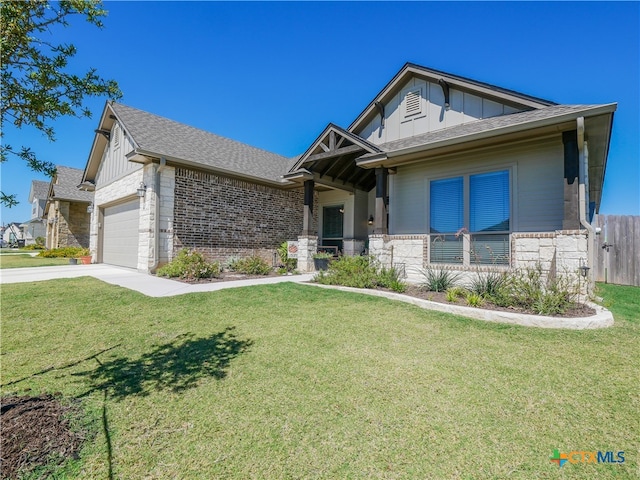 view of front of house with a garage and a front yard