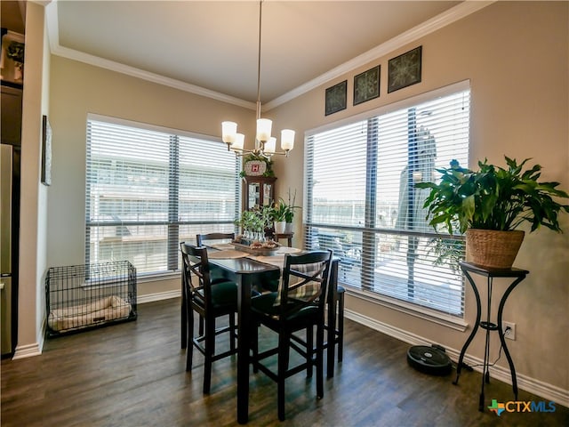 dining space with dark wood-type flooring, a notable chandelier, and ornamental molding